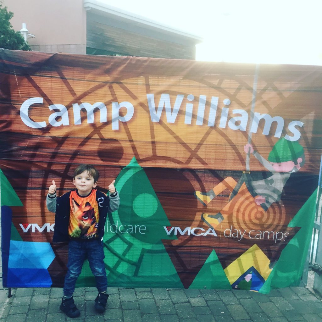 Noah-Walsh-at-Camp-Williams-sign