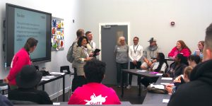 Soheila Hayek, Steffen Benbow, Peter Posner and Joe Piliero in a classroom of the YMCA Community and Activity Village with Camp Williams Staff